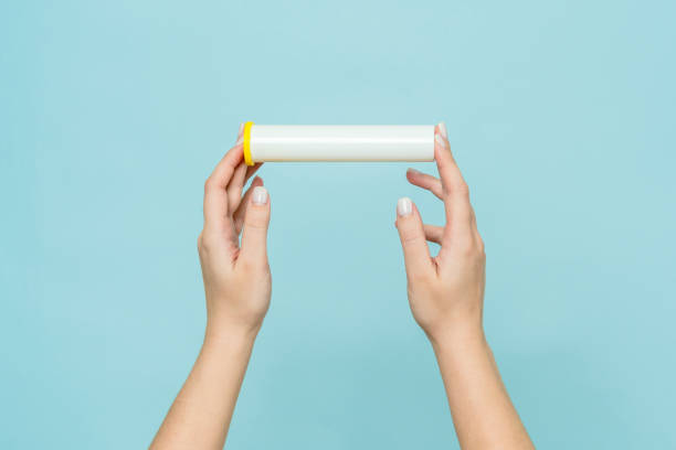 istock Tube for vitamins, pills in hand. Packaging. Mockup 2155818324