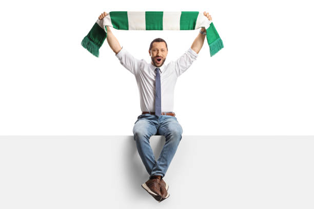 istock Businessman sitting on a panel and cheering with a scarf 2155818419
