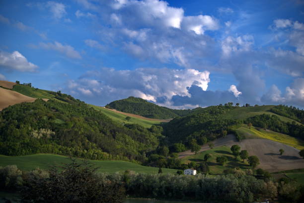 istock Hilly landscape of Montefeltro against partly cloudy sky 2155820683