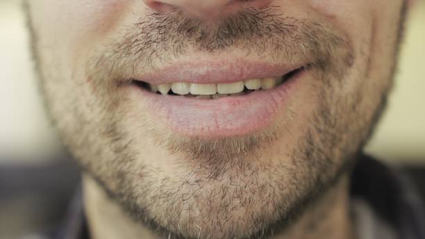 istock Caucasian bearded man smiling at camera, posing, showing teeth. Close motion 2155826077