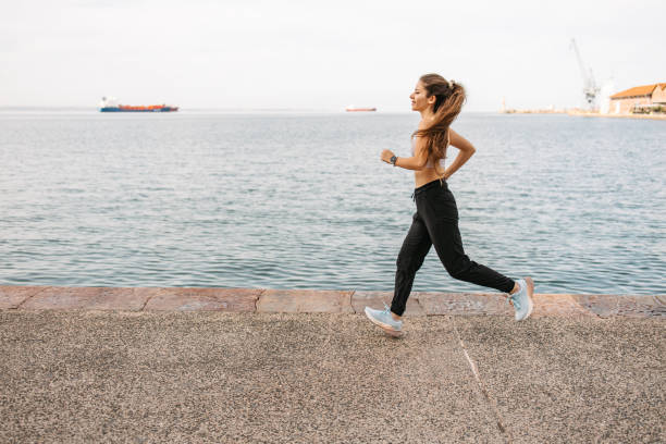 istock Running by the sea 2155826145