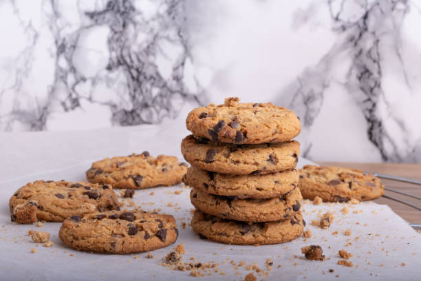 istock Stack of homemade chocolate chip cookies on white marble counter. 2155826586