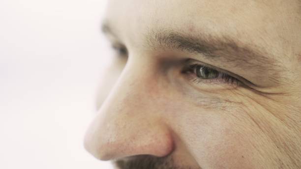 istock Smiling young man looking forward. Cropped, close up. Eye care, vision concept 2155826723