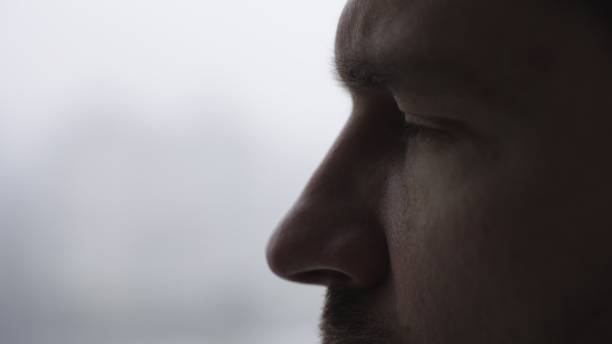 istock Thoughtful young man posing on white background, side view. Slow motion 2155826729