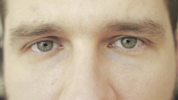 istock Close up of young man thinking about something, looking at camera. Slow motion 2155826737