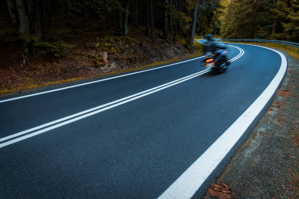 istock motorcyclist riding on the mountain road 2155832107