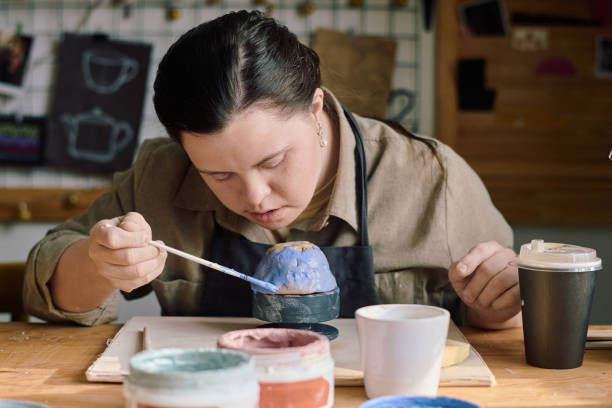 istock Woman With Disability Coloring Handmade Vessel 2155834200