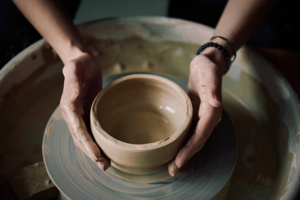 istock Hands Of Unrecognizable Artisan Making Bowl On Potters Wheel 2155834474