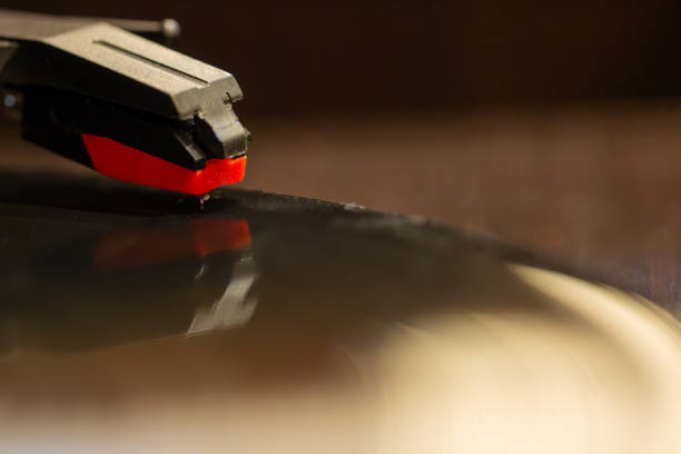 vinyl record with clear sound tracks and stylus, focus on sound tracks records, retro style, classic music concept