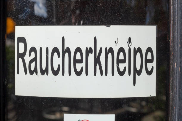 istock Smoking bar sign on a window of a pub, Germany 2155835624