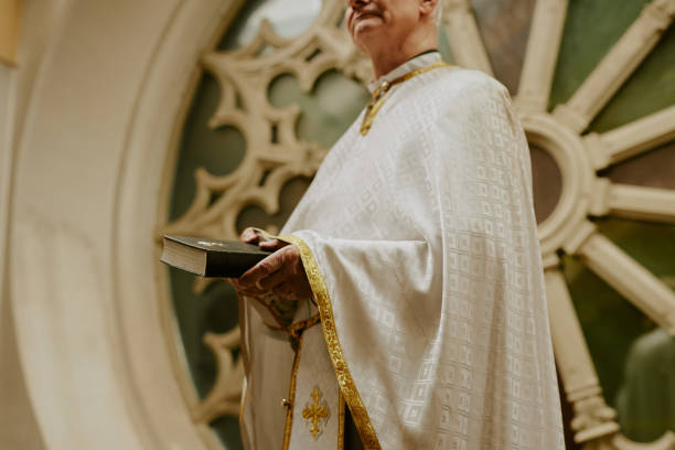 istock Senior Priest Standing On Balcony 2155837846