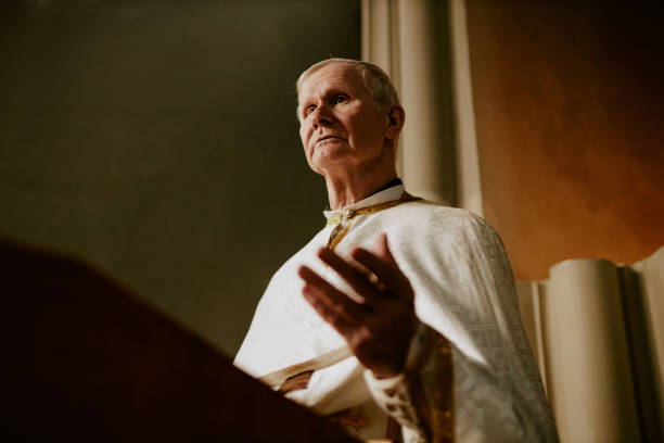 istock Priest Speaking To Parishioners 2155838053