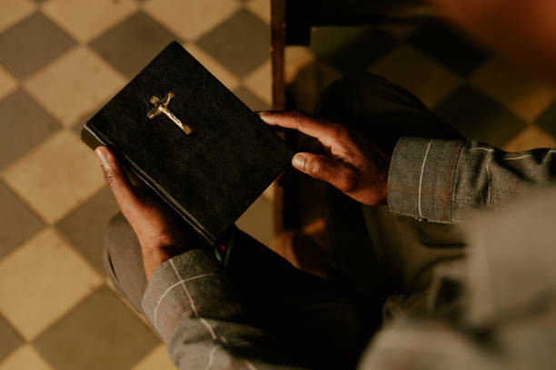 istock Unrecognizable Man With Prayer Book In Hands 2155838682