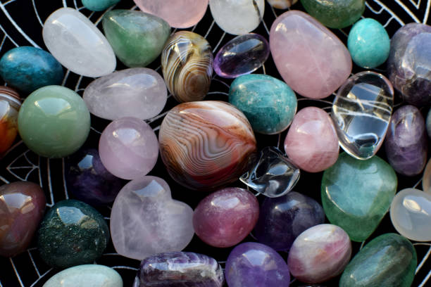 istock Beautiful natural semi-precious stones lie on a dark background. Predictions, witchcraft, spiritual esoteric practice. 2155839502