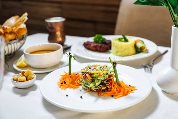 istock White Table With Assorted Plates of Food 2155839602