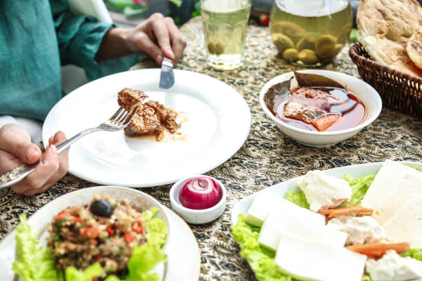 istock Table With White Plates Filled With Food 2155840579