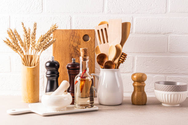 istock Kitchen utensils set to cook on a stone countertop against a white brick wall. Front view. Eco-friendly kitchen. Stylish kitchen background. 2155842732
