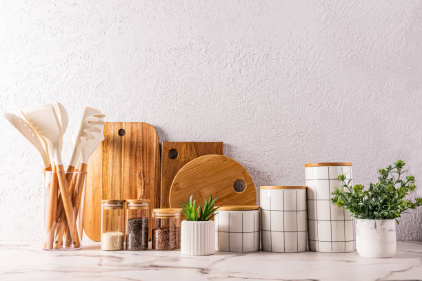 istock Stylish modern kitchen background with eco-friendly items and kitchen utensils made of natural materials. ceramic storage . wooden cutting boards. 2155842755