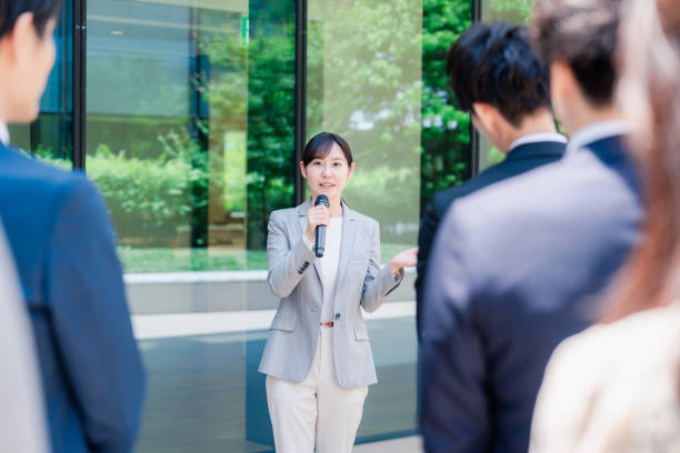 istock Young woman speaking with microphone 2155843338