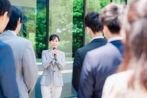 istock Young woman speaking with microphone 2155843342
