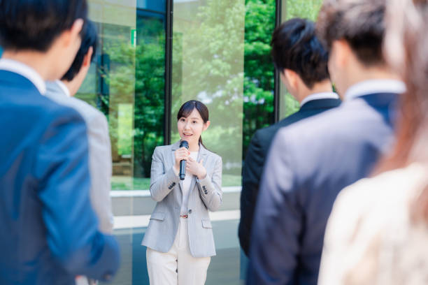 istock Young woman speaking with microphone 2155843343