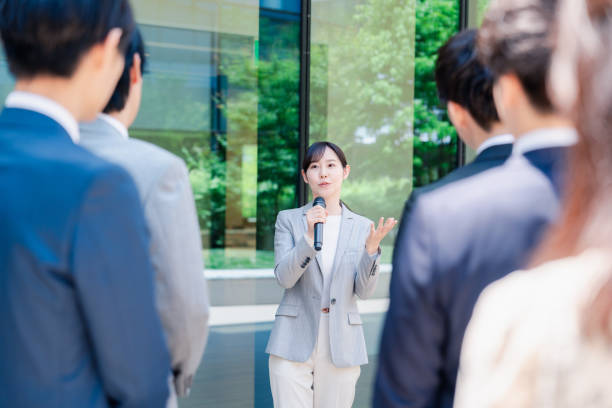 Young woman speaking with microphone