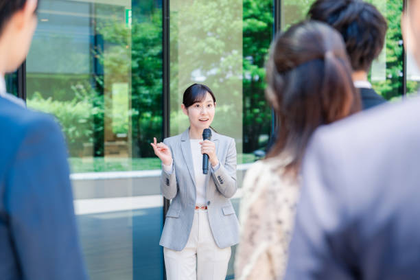 istock Young woman speaking with microphone 2155843350