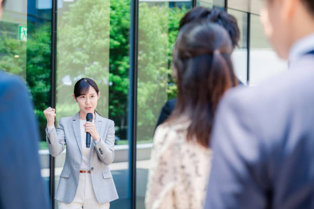 istock Young woman speaking with microphone 2155843351