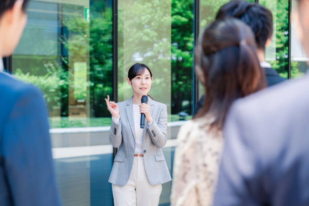 istock Young woman speaking with microphone 2155843354