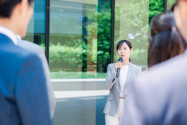 istock Young woman speaking with microphone 2155843366