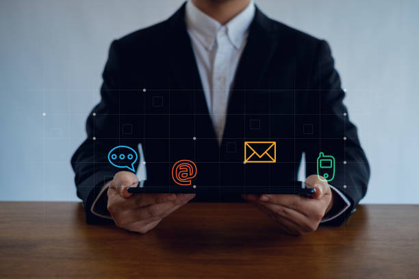 istock Businessman  touching on virtual screen with the email,  address, call phone, Chat message icons. Customer support hotline Contact us people connection. 2155844043