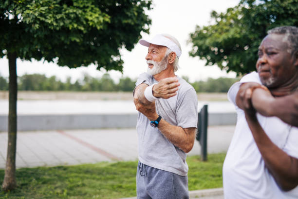 istock Two senior friends training together outside. Diverse Senior Man . 2155844796