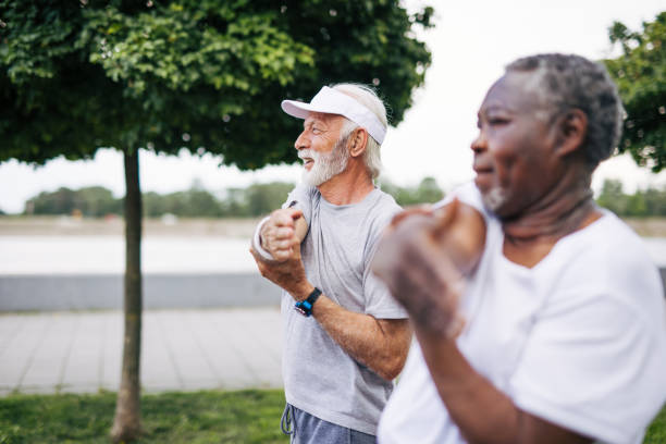 istock Two senior friends training together outside. Diverse Senior Man . 2155844976