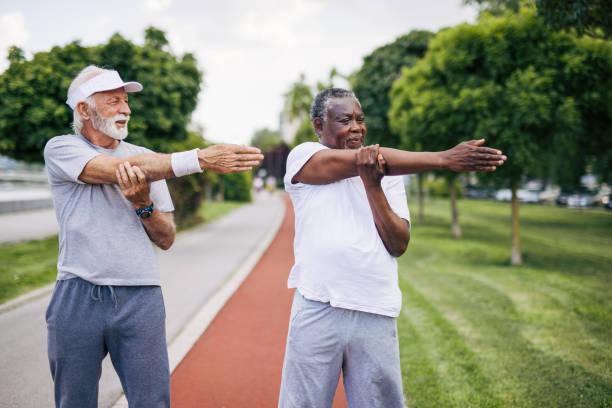 istock Two senior friends training together outside. Diverse Senior Man . 2155845142