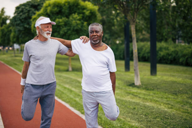 istock Two senior friends training together outside. Diverse Senior Man . 2155845379