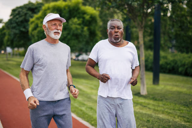 istock Two senior friends training together outside. Diverse Senior Man . 2155845588