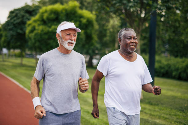 istock Two senior friends training together outside. Diverse Senior Man . 2155845649
