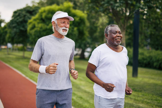 istock Two senior friends training together outside. Diverse Senior Man . 2155845840