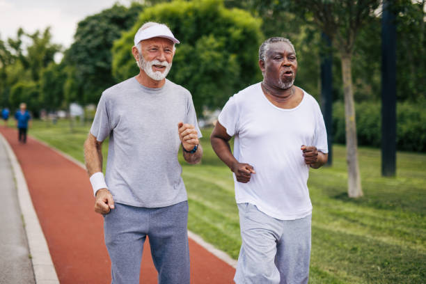 istock Two senior friends training together outside. Diverse Senior Man . 2155845954