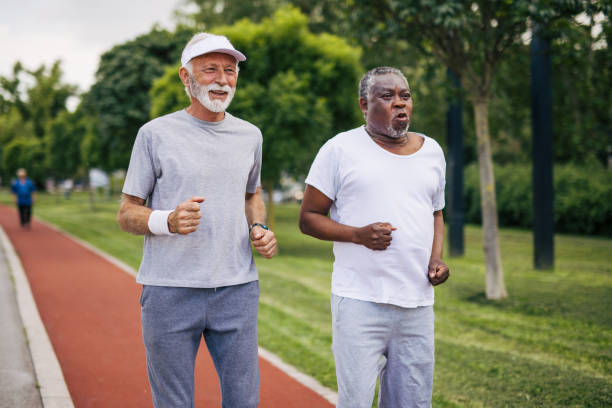 istock Two senior friends training together outside. Diverse Senior Man . 2155846188