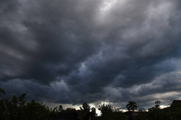 istock Dramatic dark storm rain clouds black sky background. Dark thunderstorm clouds rainny atmosphere. Meteorology danger windstorm disasters climate. Dark cloudscape storm disaster gloomy gray cloud sky 2155846355