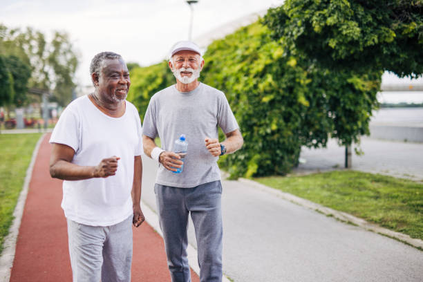 istock Two senior friends training together outside. Diverse Senior Man . 2155847152
