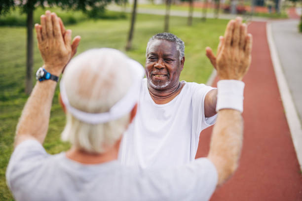 istock Two senior friends training together outside. Diverse Senior Man . 2155848429