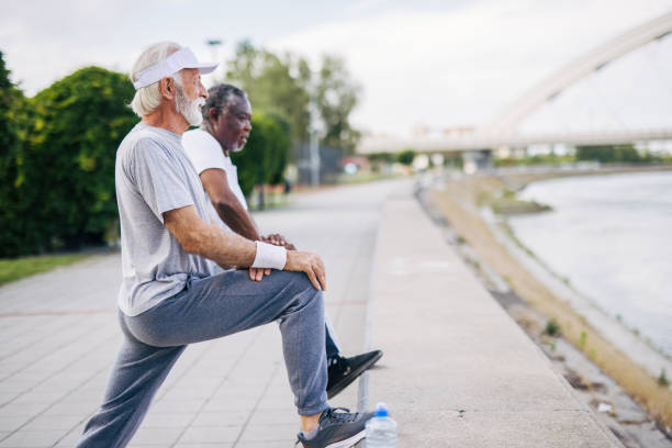 istock Two senior friends training together outside. Diverse Senior Man . 2155848533