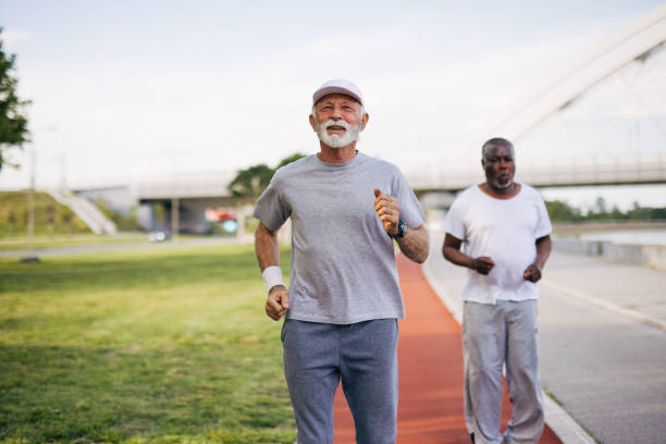 istock Two senior friends training together outside. Diverse Senior Man . 2155848878