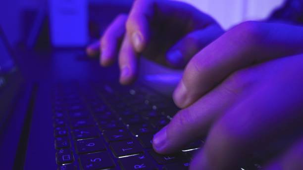 istock Male hands with laptop above typing in night. Slow motion 2155850631