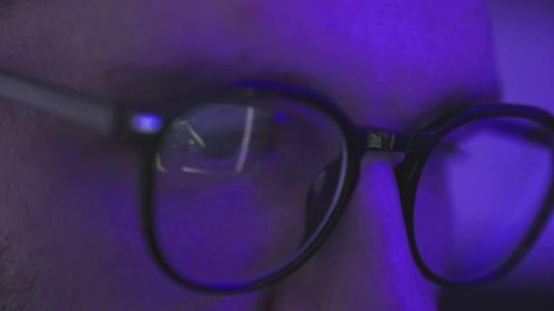 istock Young man with glasses looking at screen, watching dj fest party. Slow motion 2155850916