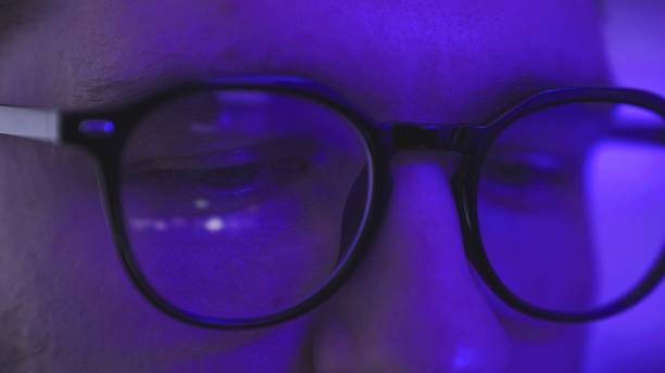 istock Guy watching dj party show on the gadget screen. Reflection in glasses 2155850938