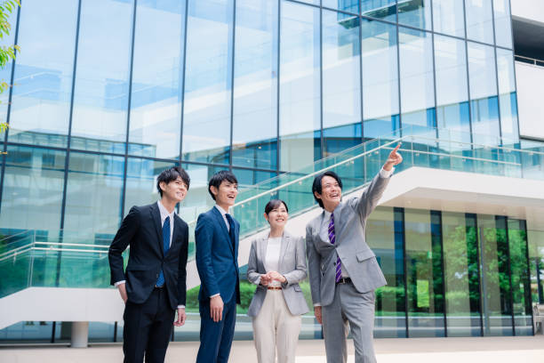 istock Business people pointing to the future with a smile 2155851296