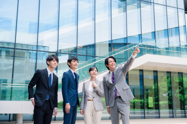 istock Business people pointing to the future with a smile 2155851303